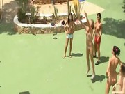 Five naked women getting wet outside