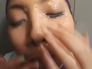 Real japanese babe gets bukkake and play with the cum