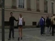 Blonde bound and stripped naked in the middle of a city square a