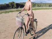Huge breasted Euro slut Katrina gets naked and rides her bike